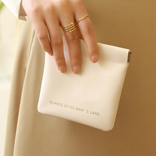 Key storage bag with automatic closure, light luxury and simple cosmetic bag, portable storage bag with elastic piece closure, mini bag