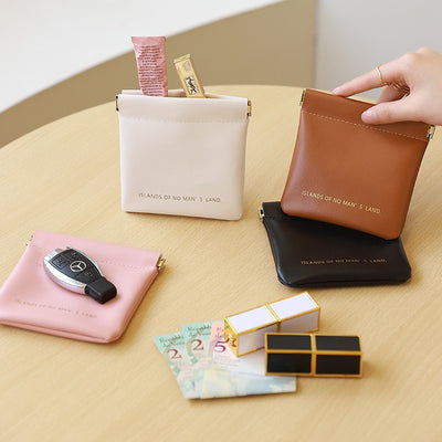 Key storage bag with automatic closure, light luxury and simple cosmetic bag, portable storage bag with elastic piece closure, mini bag