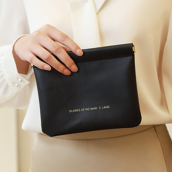 Key storage bag with automatic closure, light luxury and simple cosmetic bag, portable storage bag with elastic piece closure, mini bag